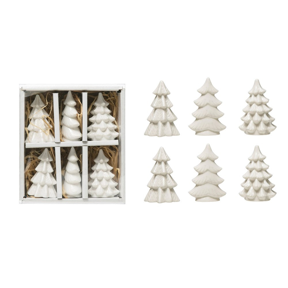 6 white ceramic trees with assorted shapes in a box and 6 trees arranged next to box.