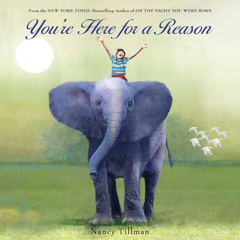 front cover of book has a boy riding a large elephant, title of book in blue, and author's name