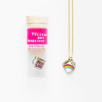 necklace shown in glass vile packaging on white background.