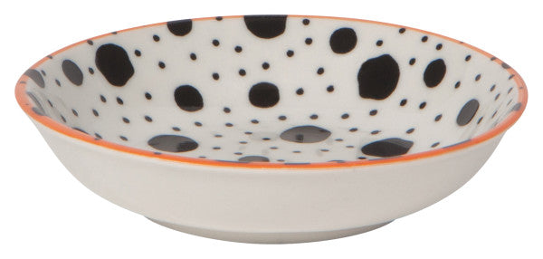 side view of dish with black dots on the interior and orange rim.
